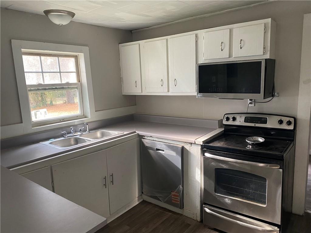 2201 Southern Street Northeast Rome, GA 30161 - Photo 6 of 9 a kitchen with a stove microwave and sink
