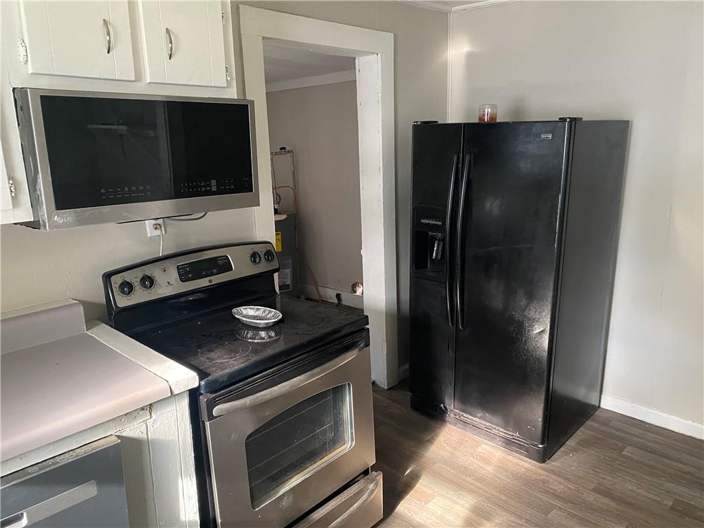 2201 Southern Street Northeast Rome, GA 30161 - Photo 7 of 9 a kitchen with a refrigerator stove and microwave