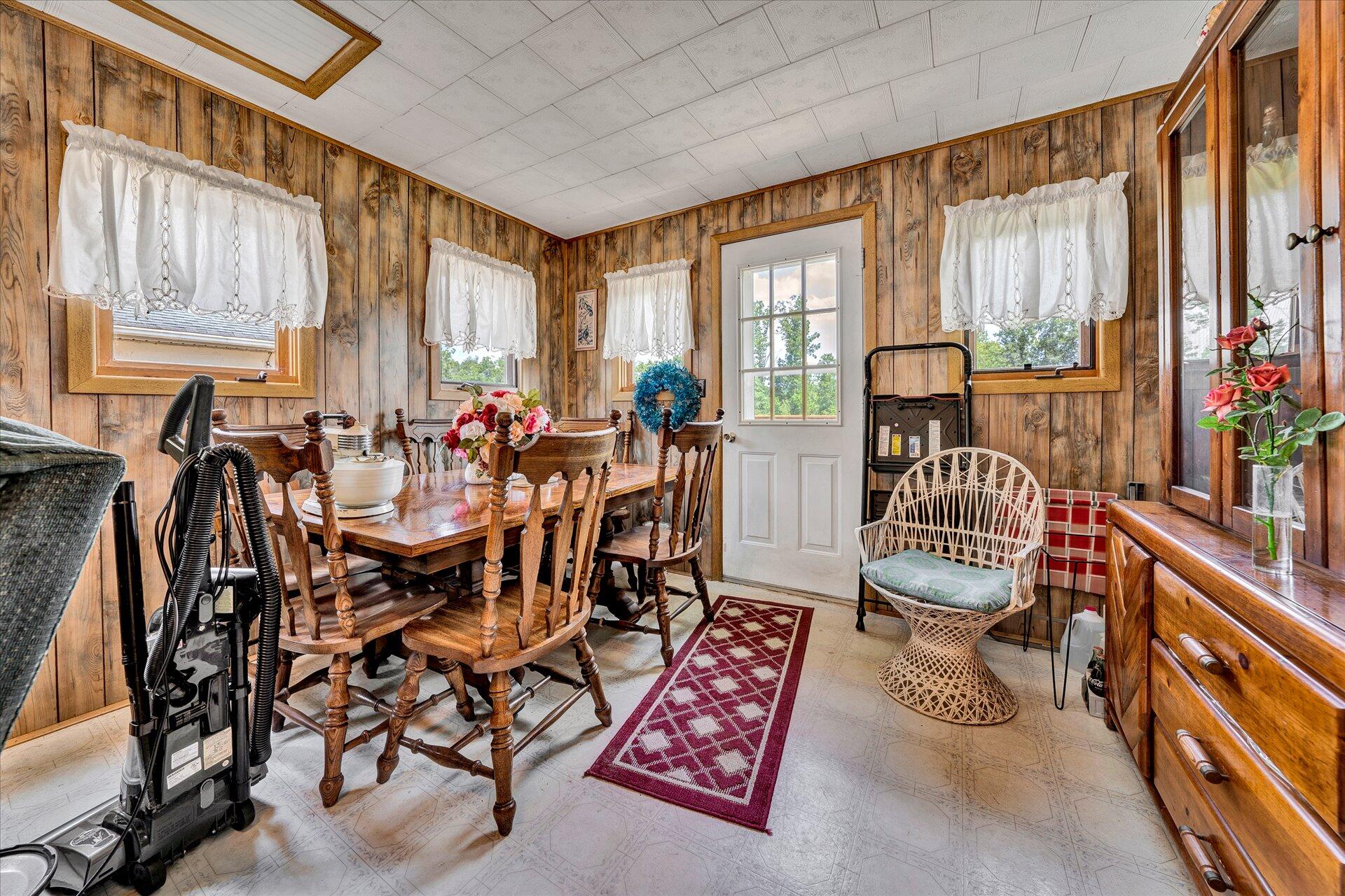 950 Thompson Ridge Road Ferrum, VA 24088 - Photo 14 of 31 a view of a dining room with furniture window and outside view