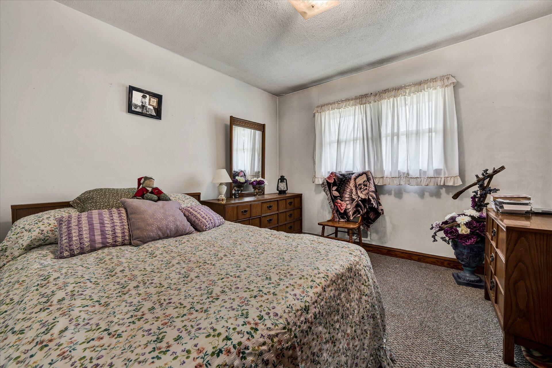 950 Thompson Ridge Road Ferrum, VA 24088 - Photo 18 of 31 a bedroom with two beds and a large mirror