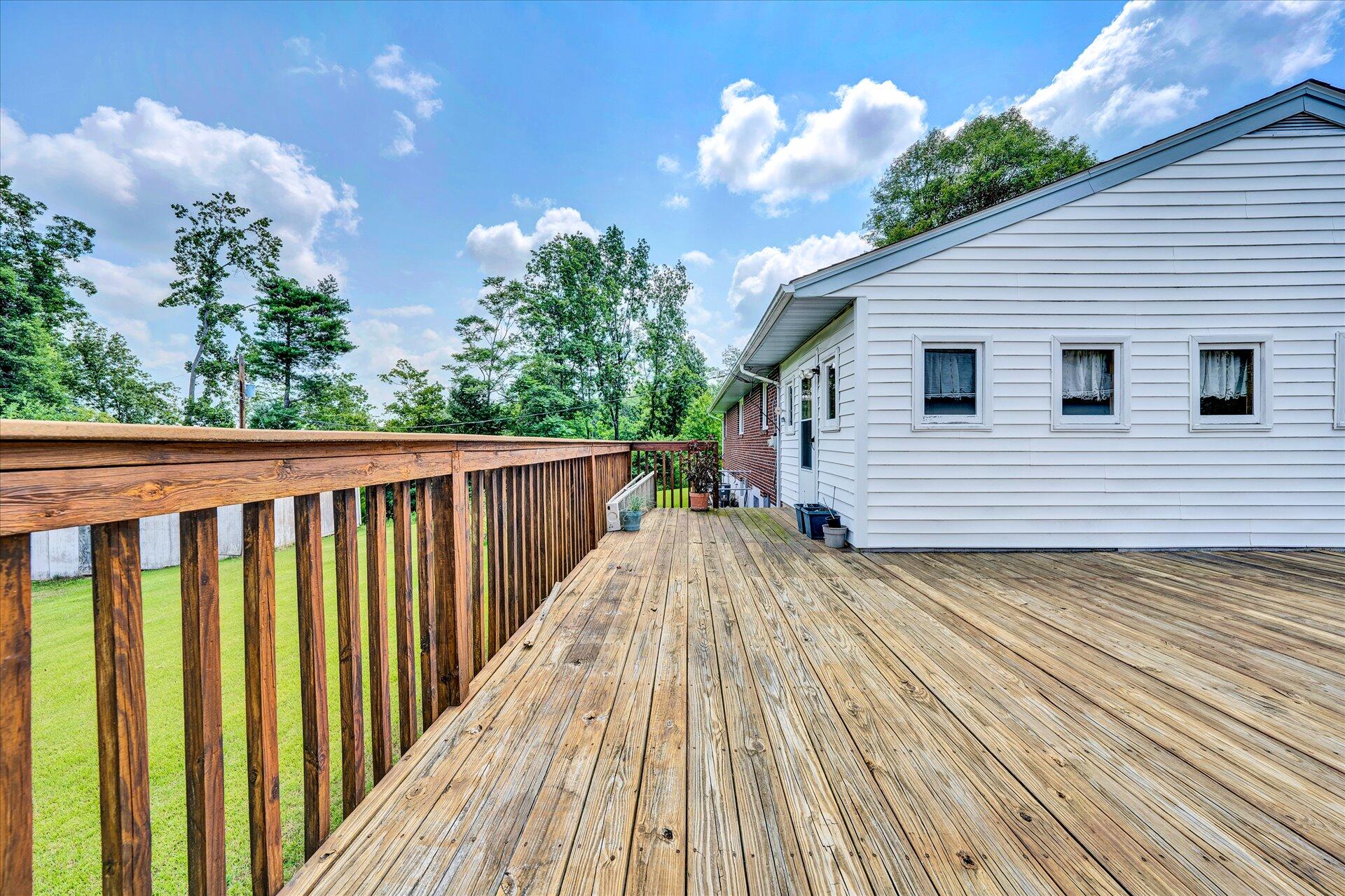 950 Thompson Ridge Road Ferrum, VA 24088 - Photo 24 of 31 a view of backyard with a deck and wooden floor