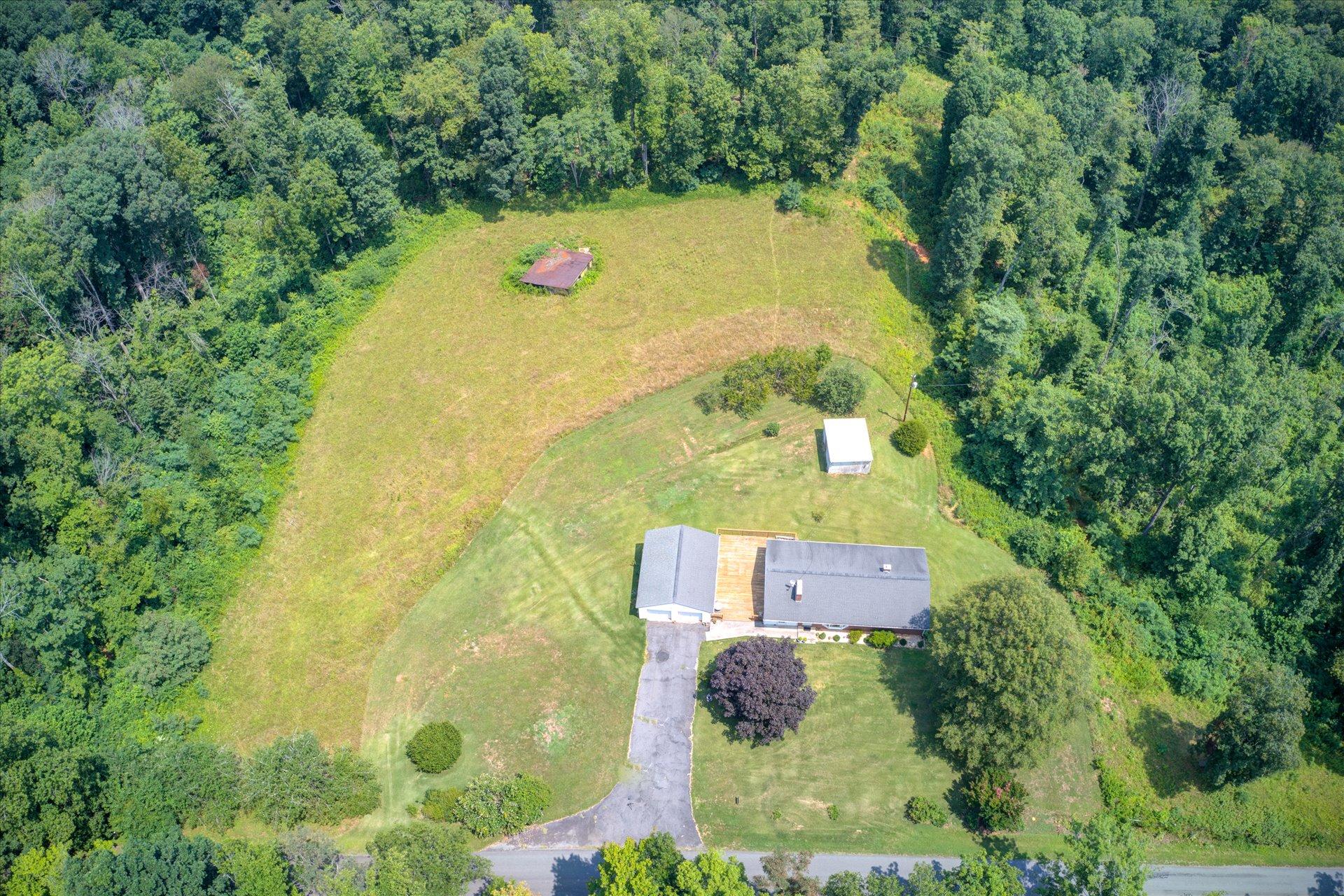 950 Thompson Ridge Road Ferrum, VA 24088 - Photo 29 of 31 an aerial view of a house with a yard