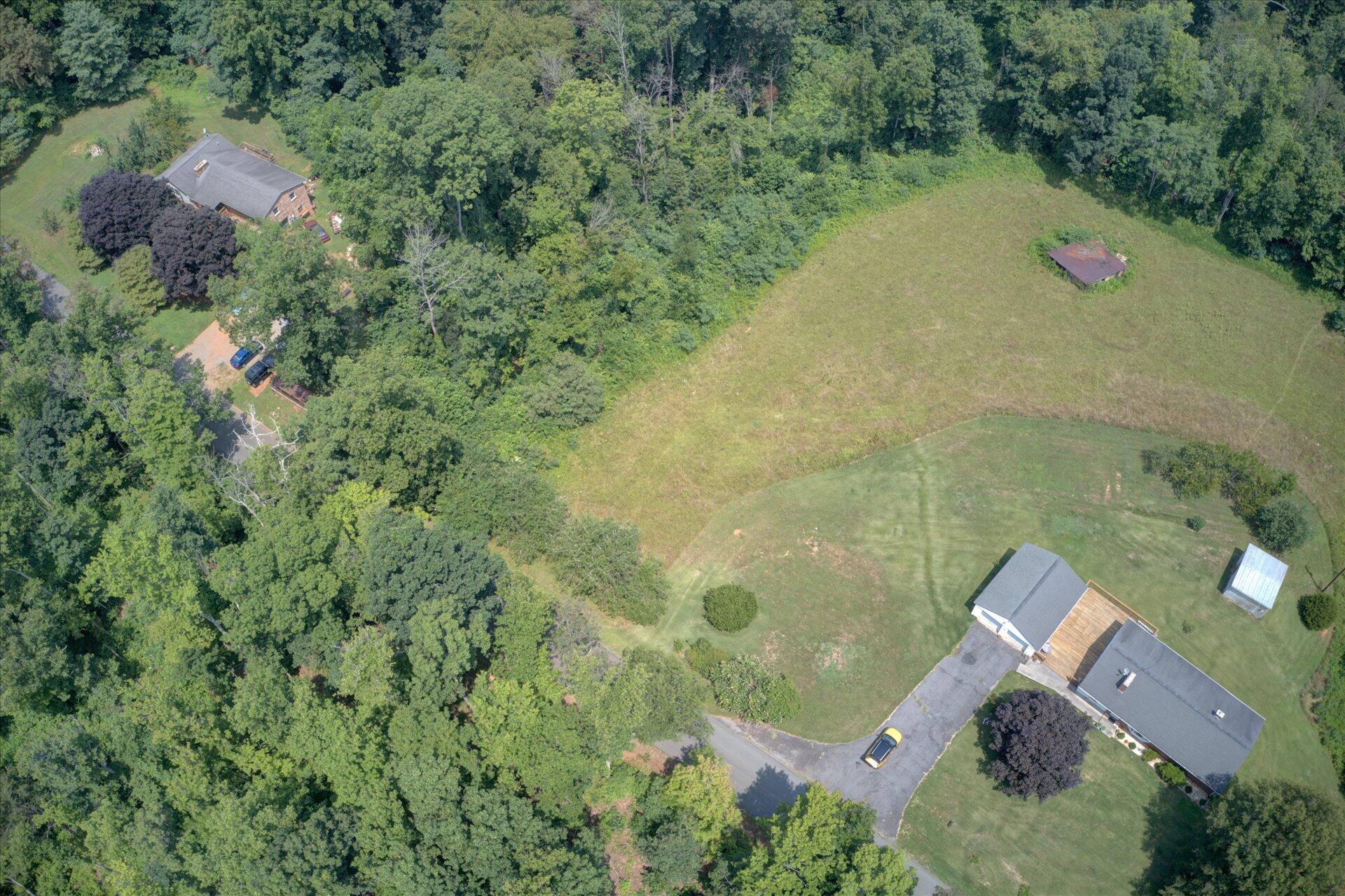 950 Thompson Ridge Road Ferrum, VA 24088 - Photo 31 of 31 an aerial view of house with yard and outdoor seating