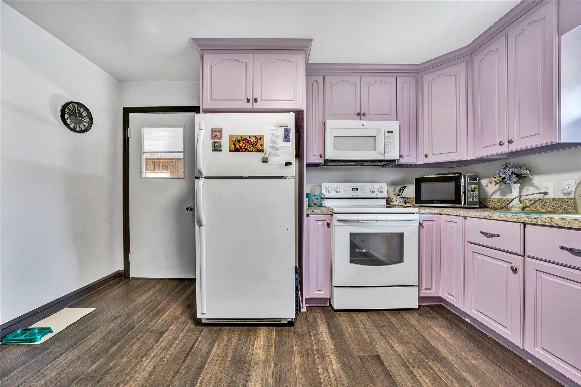 950 Thompson Ridge Road Ferrum, VA 24088 - Photo 10 of 31 a kitchen with a refrigerator and cabinets