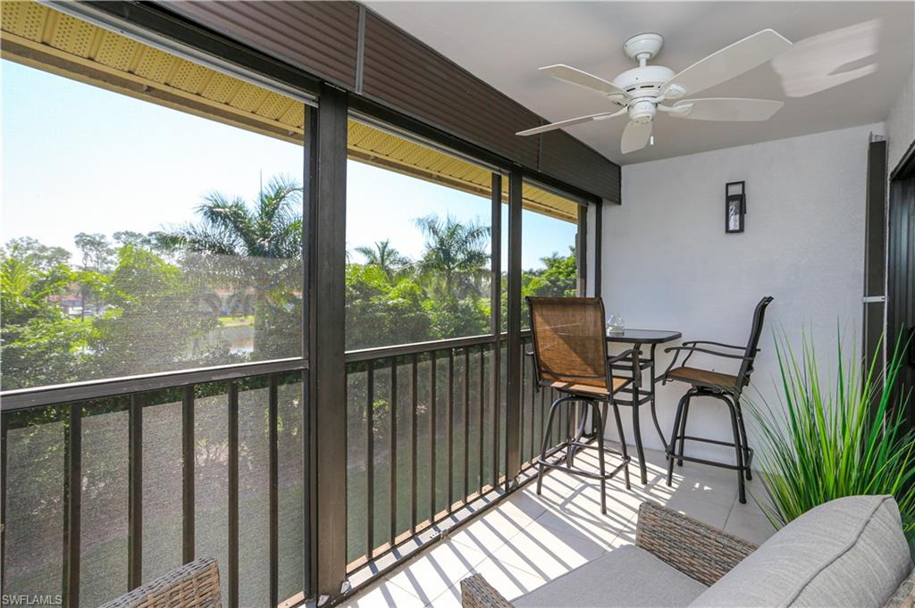 5733 Deauville Circle, Unit G308 Naples, FL 34112 - Photo 29 of 50 a view of a dining room with furniture window and outside view