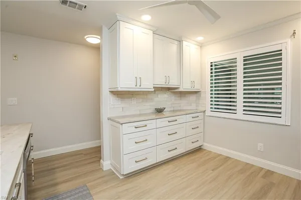 a view of cabinet and window in a room