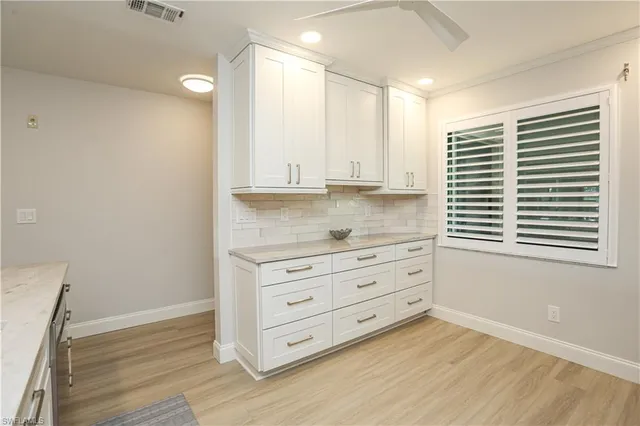a view of cabinet and window in a room