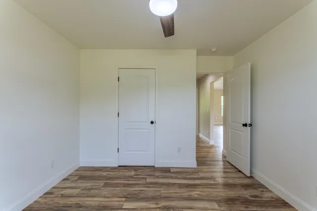 a view of a livingroom and wooden floor