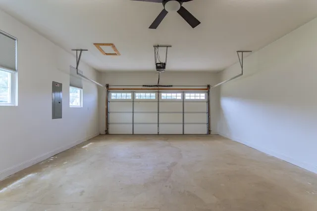 a view of an empty room with windows