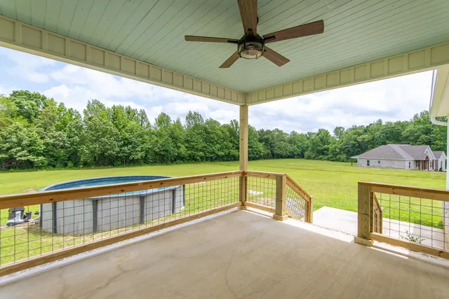 a view of swimming pool with a balcony
