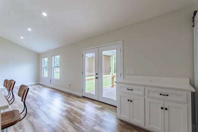 a view of a livingroom with furniture wooden floor and window