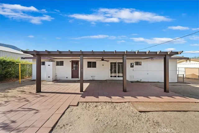 a view of a house with a sink and backyard