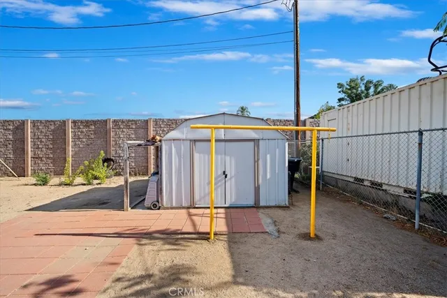 a view of a porch with furniture and a yard