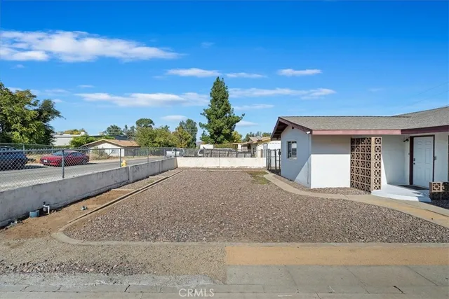 a view of a house with a street