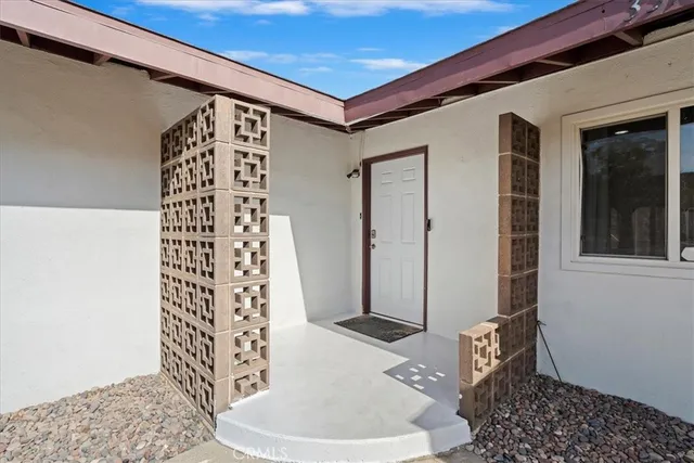 a bath room with a rug and a window