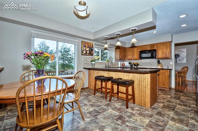 2208 Ramsgate Terrace Colorado Springs, CO 80919 - Photo 9 of 32 Updated kitchen with breakfast bar and in eat in nook