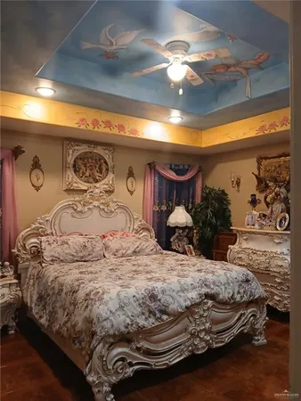 a bedroom with a bed and lamp