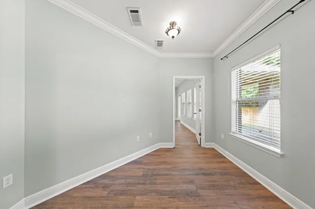 a view of a house with backyard and porch