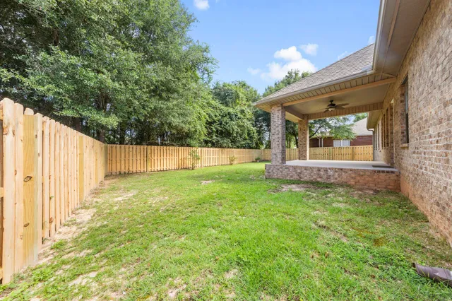 an aerial view of a house with a swimming pool