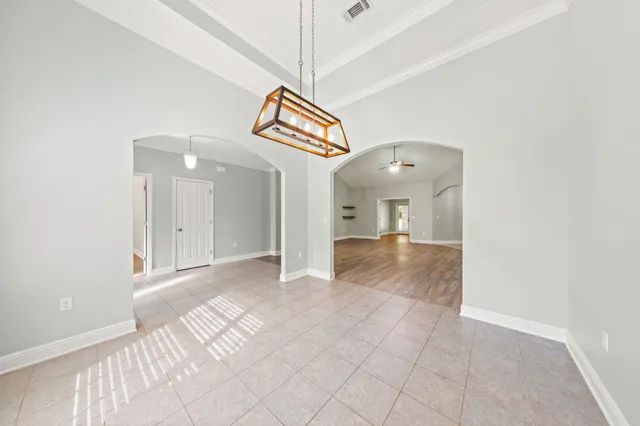a view of a kitchen with wooden floor and a kitchen