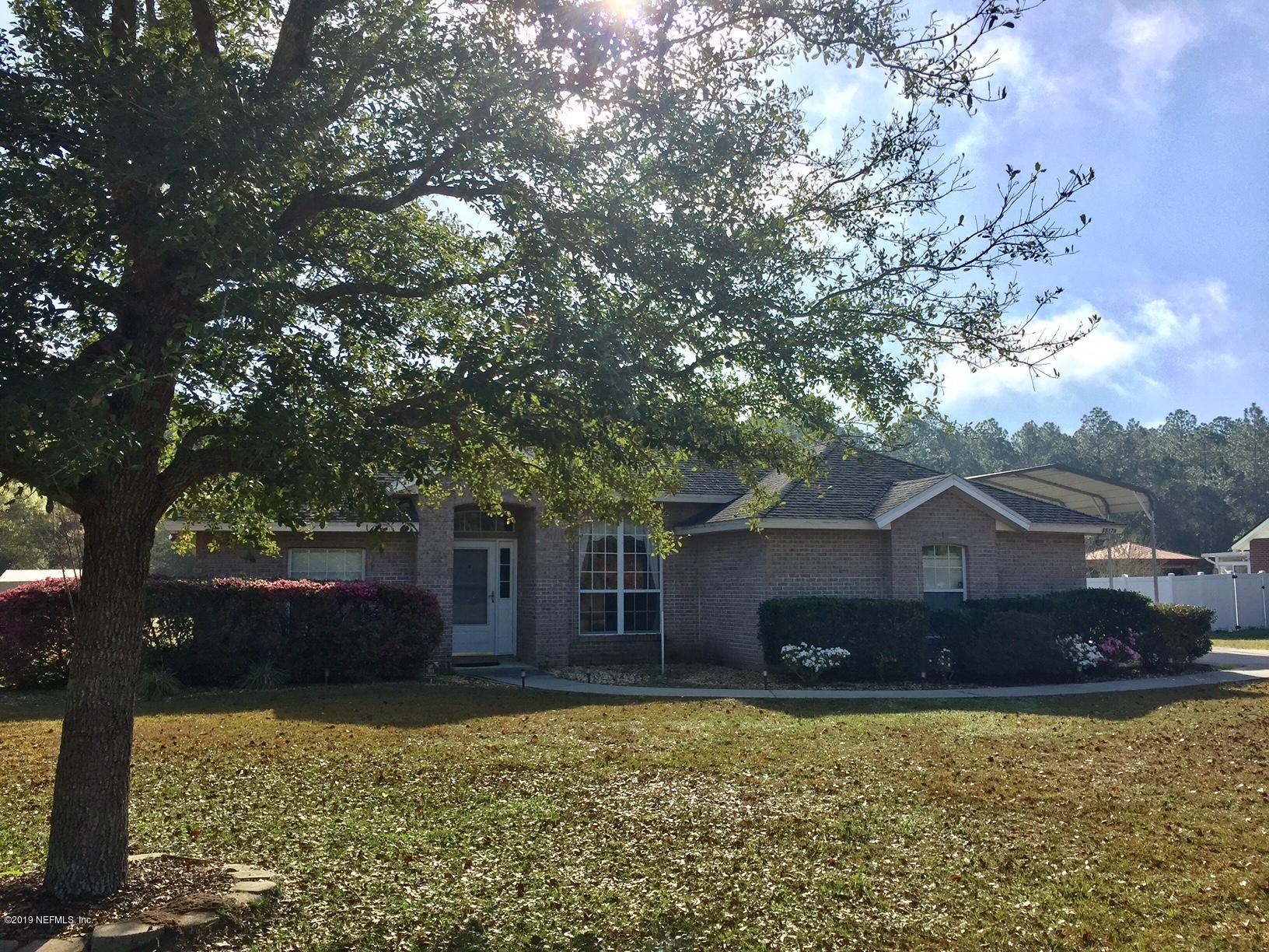 55178 Bear Run Road Callahan, FL 32011 - Photo 1 of 4 a front view of house with yard and trees