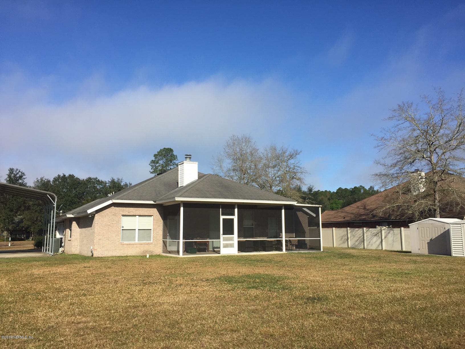 55178 Bear Run Road Callahan, FL 32011 - Photo 2 of 4 a front view of a house with a yard
