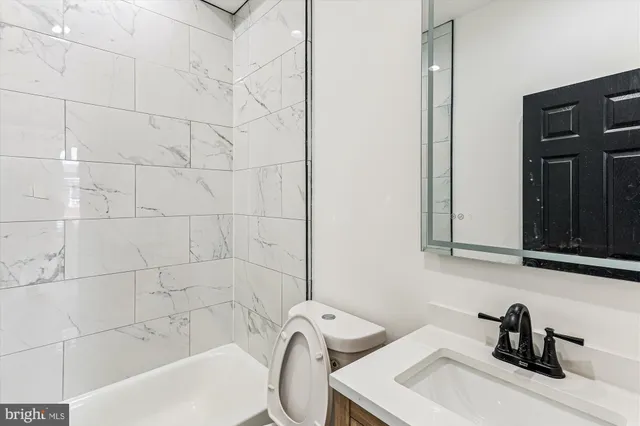 a bathroom with a sink and bathtub