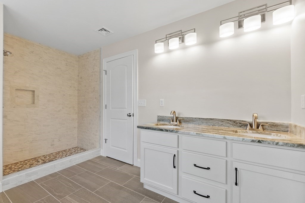 213 Worcester Road Princeton, MA 01541 - Photo 23 of 36 a bathroom with a granite countertop sink and a mirror