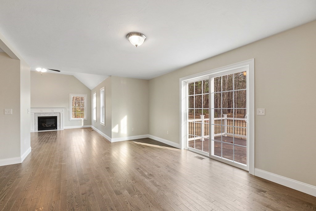 213 Worcester Road Princeton, MA 01541 - Photo 10 of 36 a view of an empty room with wooden floor and a window
