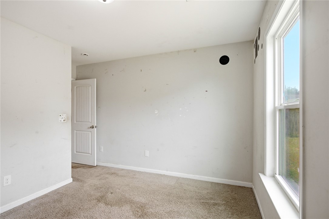 245 Maple Grove Road Seneca, SC 29678 - Photo 25 of 40 This spacious room offers natural light, ready for personalized touches.