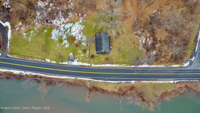 a view of a floor to ceiling window and an outdoor space