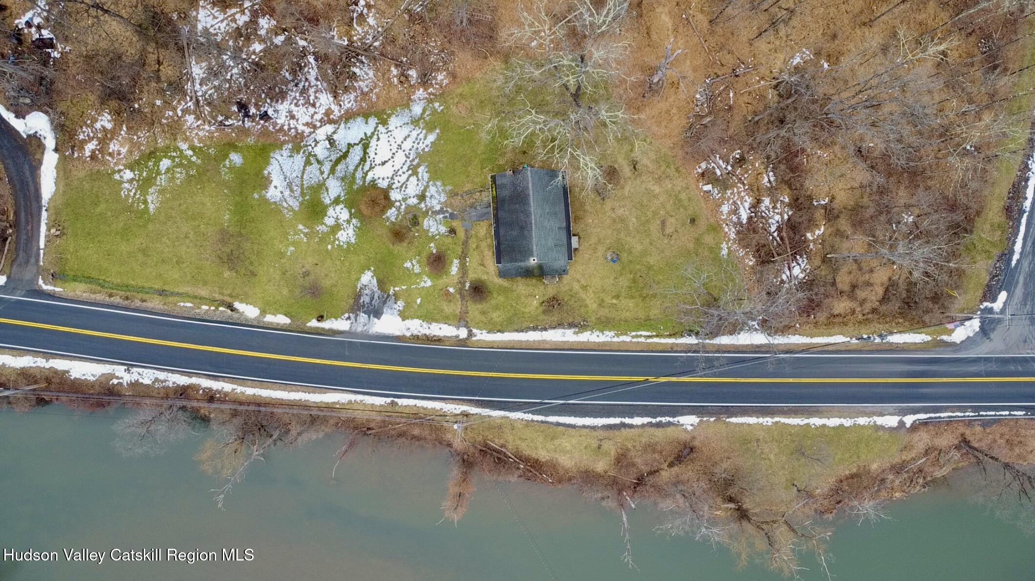 5208 Cauterskill Road Catskill, NY 12414 - Photo 17 of 23 a view of a floor to ceiling window and an outdoor space