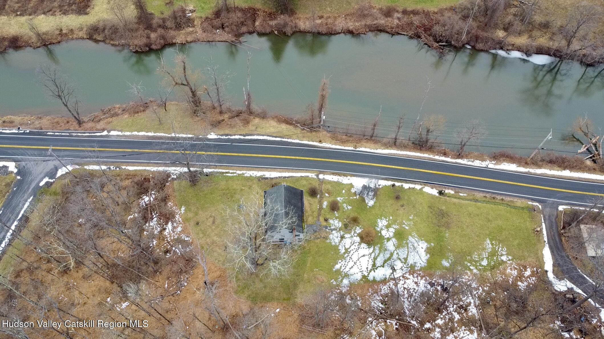 5208 Cauterskill Road Catskill, NY 12414 - Photo 19 of 23 a view of a lake from a yard