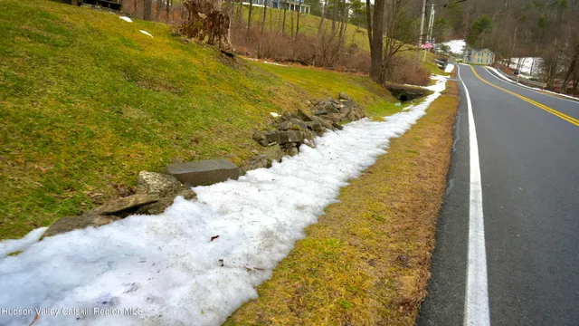 a view of a pathway both side of house