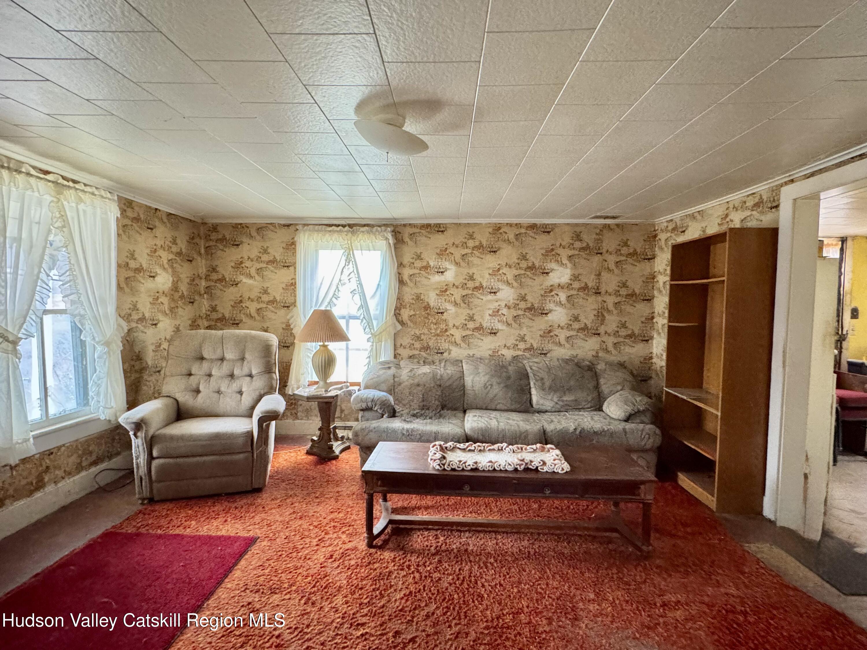 5208 Cauterskill Road Catskill, NY 12414 - Photo 6 of 23 a living room with furniture lamp and large window