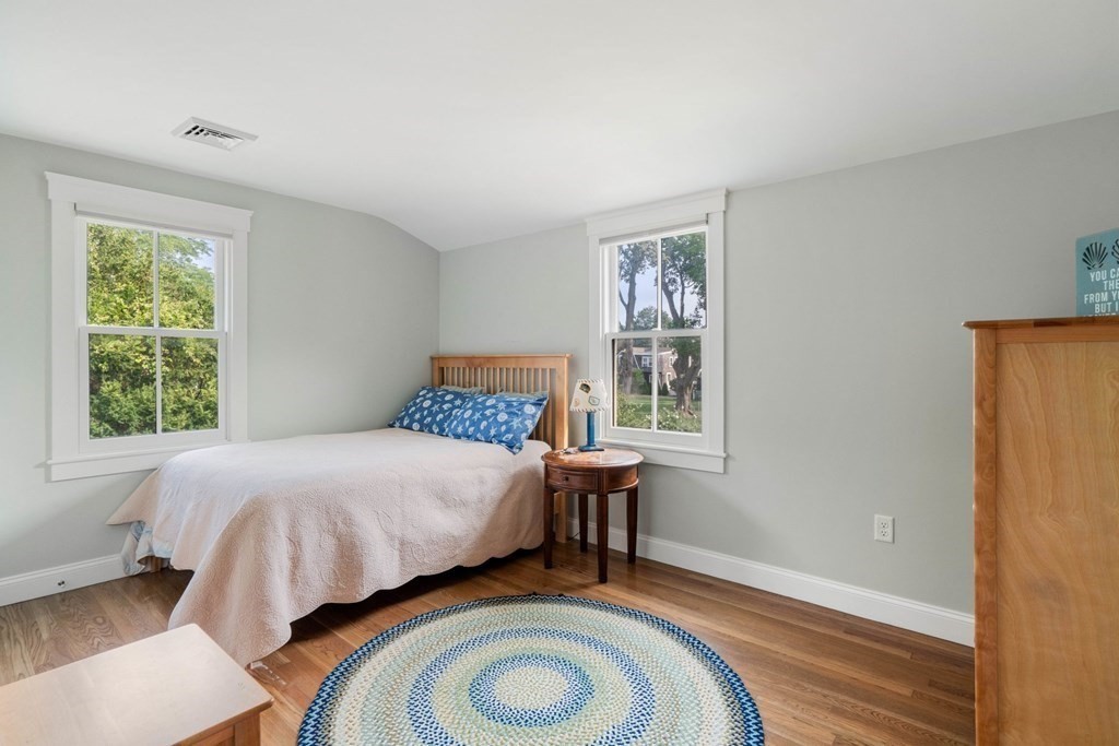616 Hatherly Road Scituate, MA 02066 - Photo 23 of 34 a bedroom with a bed and a window
