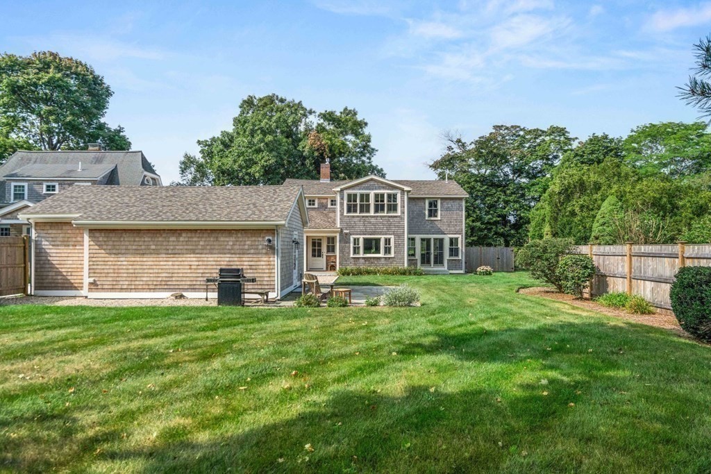 616 Hatherly Road Scituate, MA 02066 - Photo 27 of 34 a front view of a house with a garden and trees