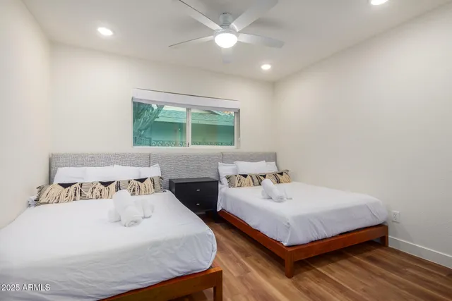 a bedroom with a bed and window