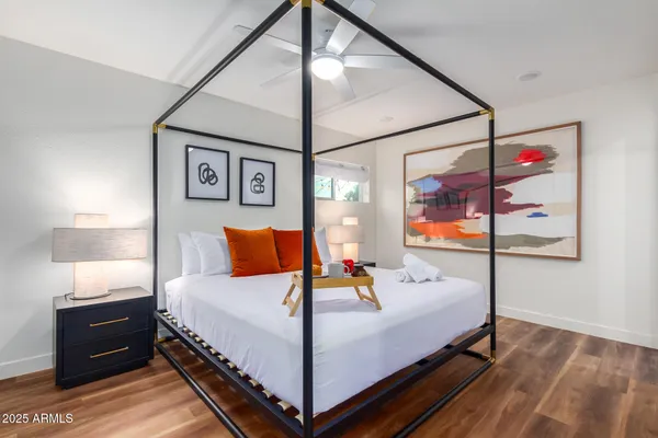 a bedroom with a bed and window