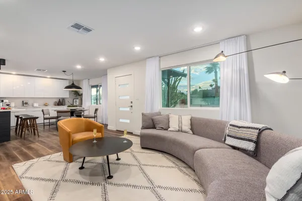 a living room with furniture and a large window