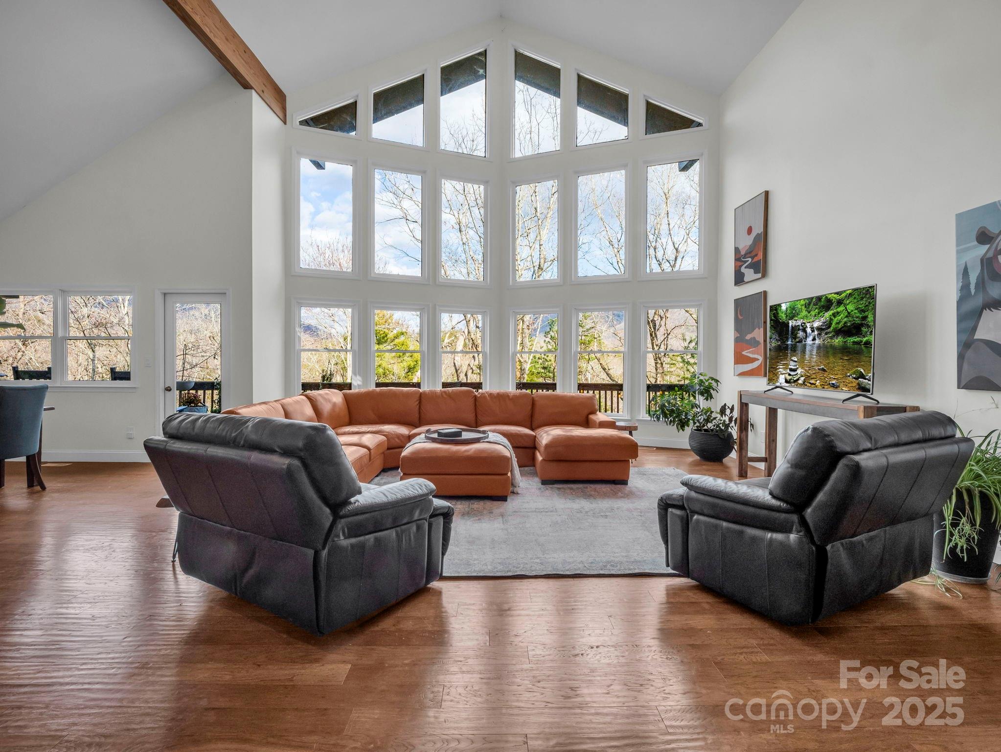 158 Rock Spring Road Lake Lure, NC 28746 - Photo 2 of 48 a living room with furniture and a large window