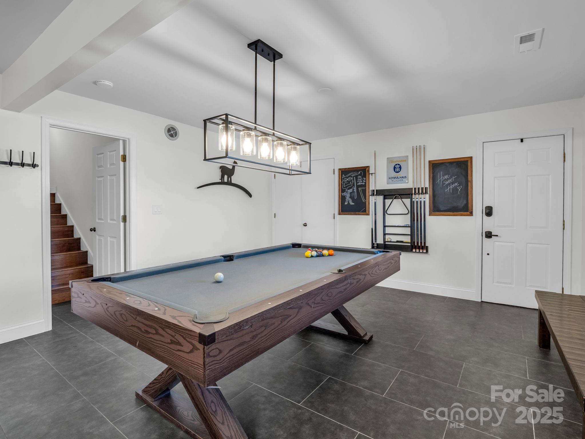 158 Rock Spring Road Lake Lure, NC 28746 - Photo 34 of 48 a room with pool table and wooden floor