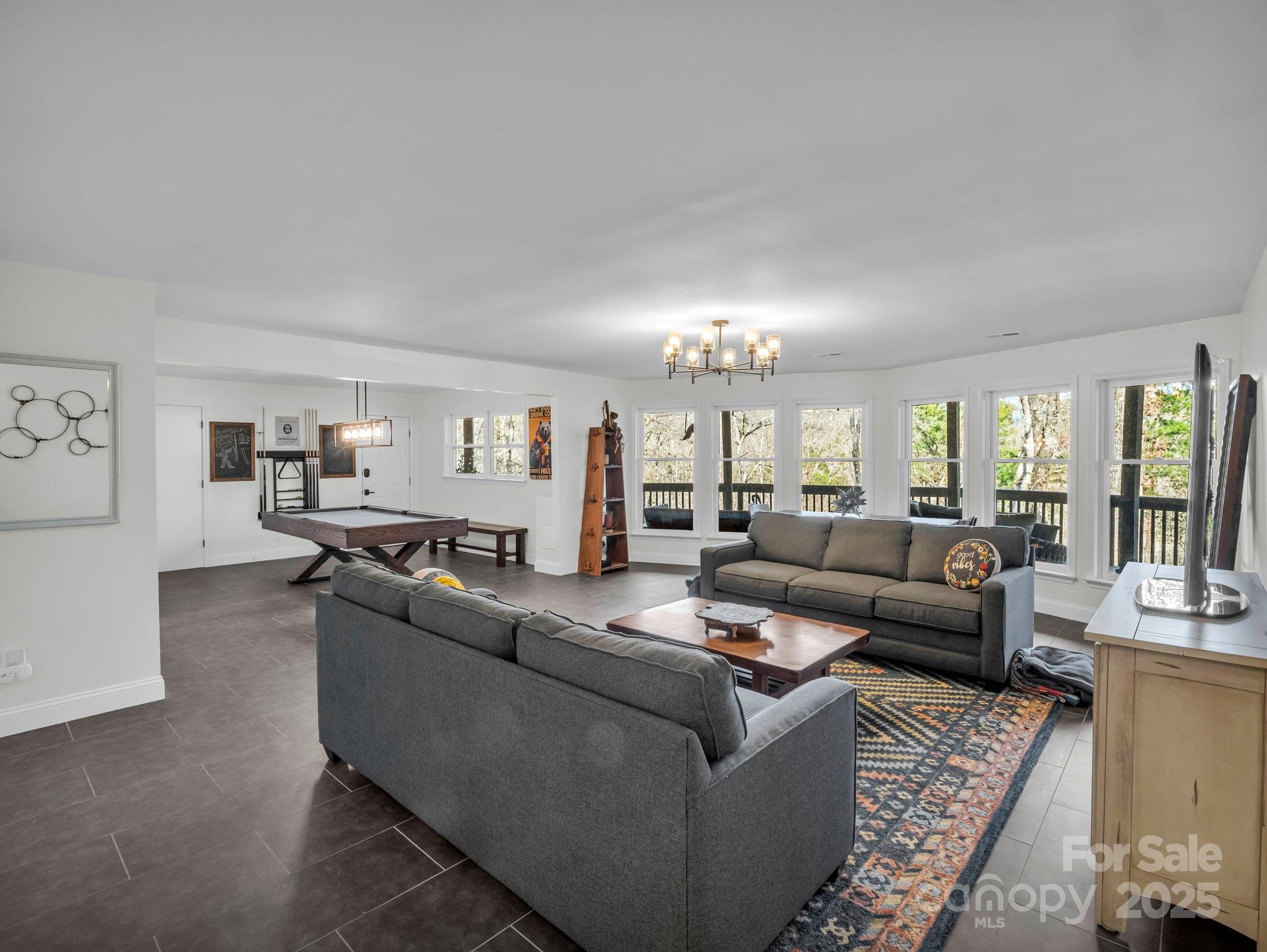 158 Rock Spring Road Lake Lure, NC 28746 - Photo 36 of 48 a living room with furniture and a view of kitchen
