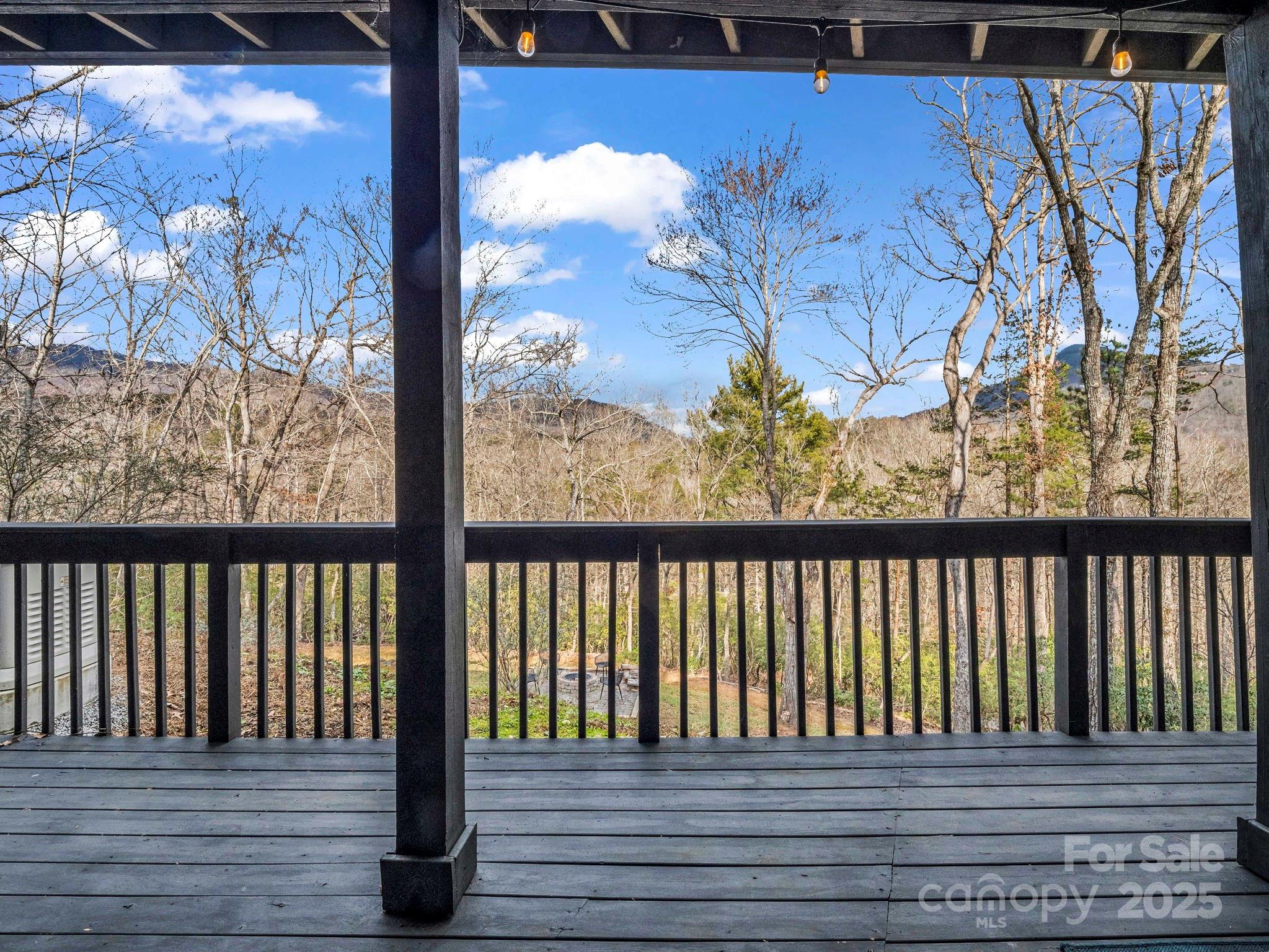 158 Rock Spring Road Lake Lure, NC 28746 - Photo 43 of 48 a view of a balcony with wooden floor
