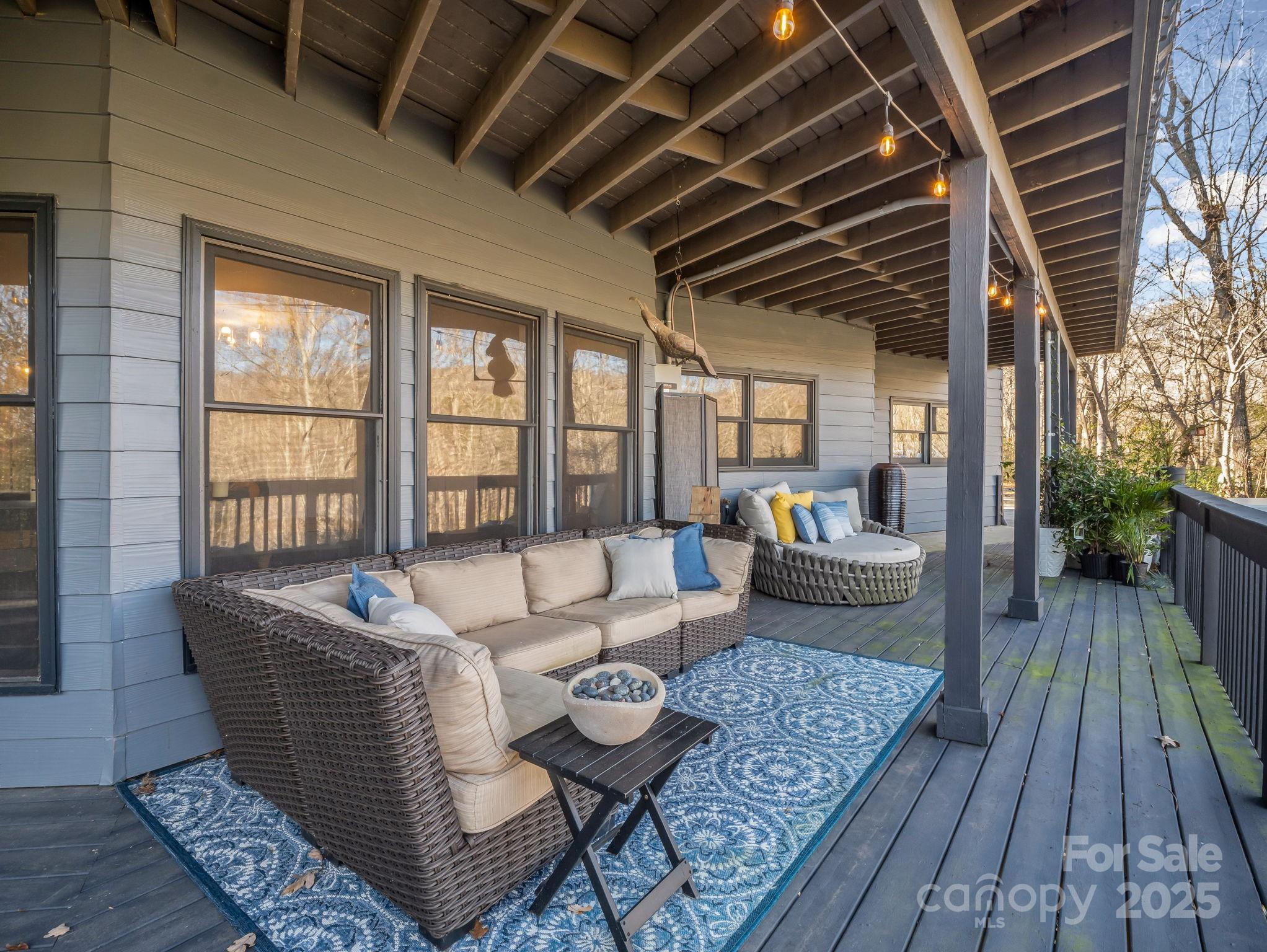 158 Rock Spring Road Lake Lure, NC 28746 - Photo 45 of 48 a living room with furniture and wooden floor
