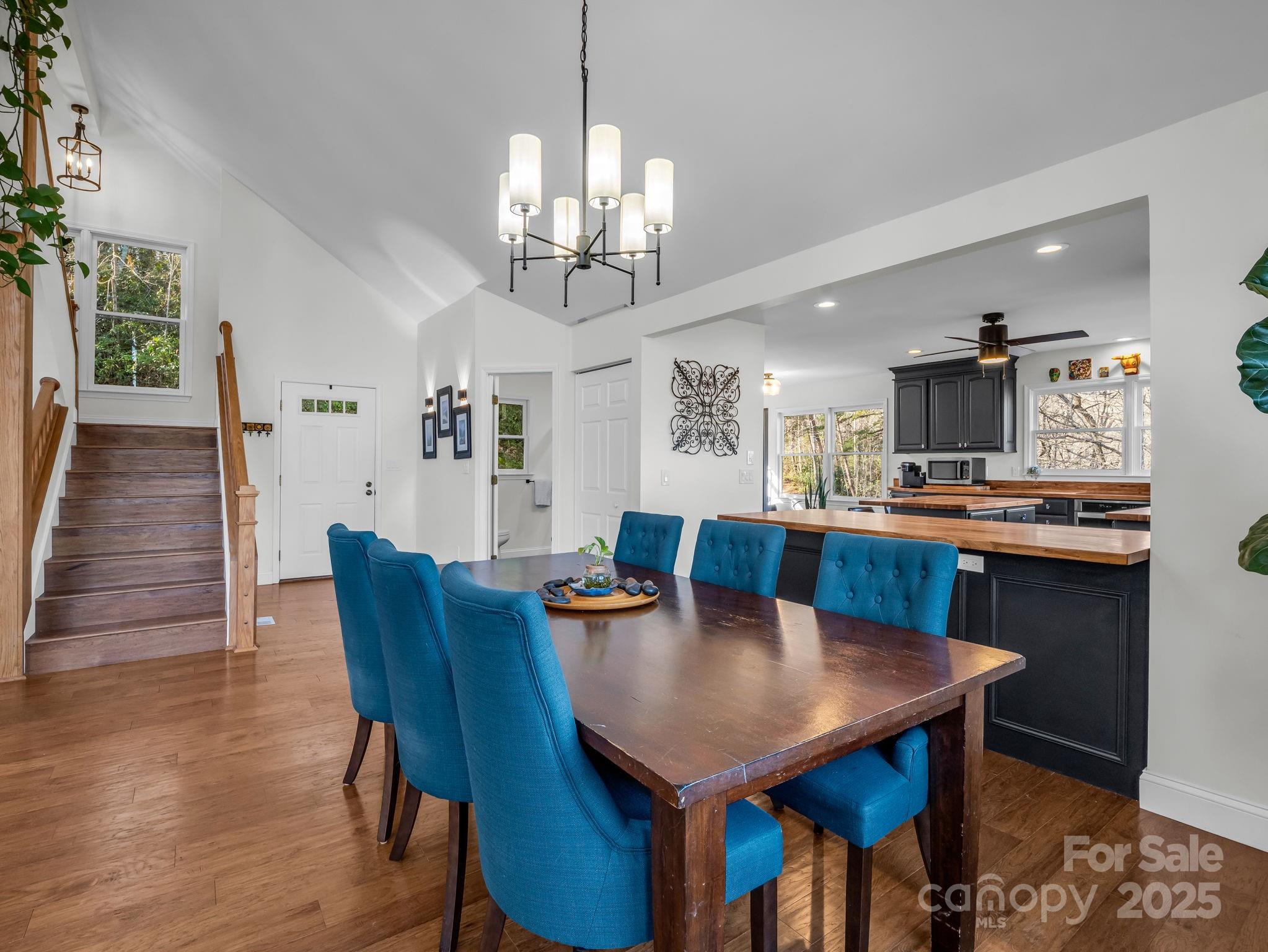 158 Rock Spring Road Lake Lure, NC 28746 - Photo 7 of 48 a view of a dining room with furniture and wooden floor