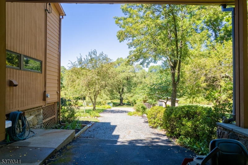 833 Berkshire Valley Road Wharton, NJ 07885 - Photo 5 of 48 a view of a yard with plants and large trees