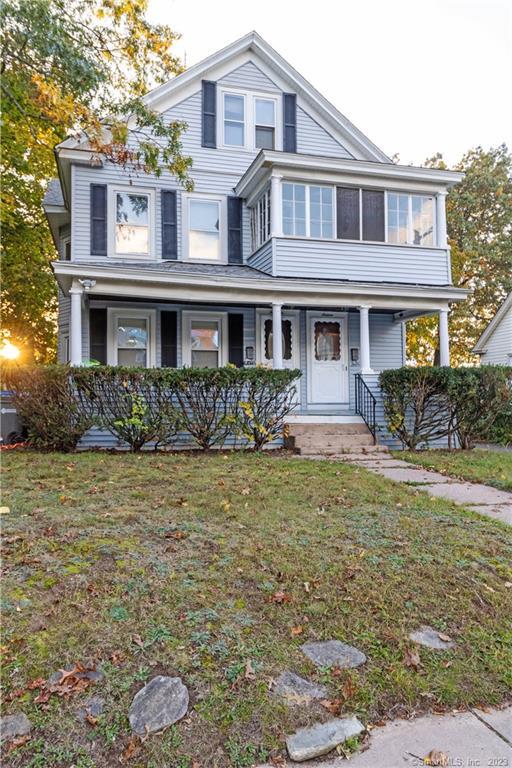a front view of a house with garden