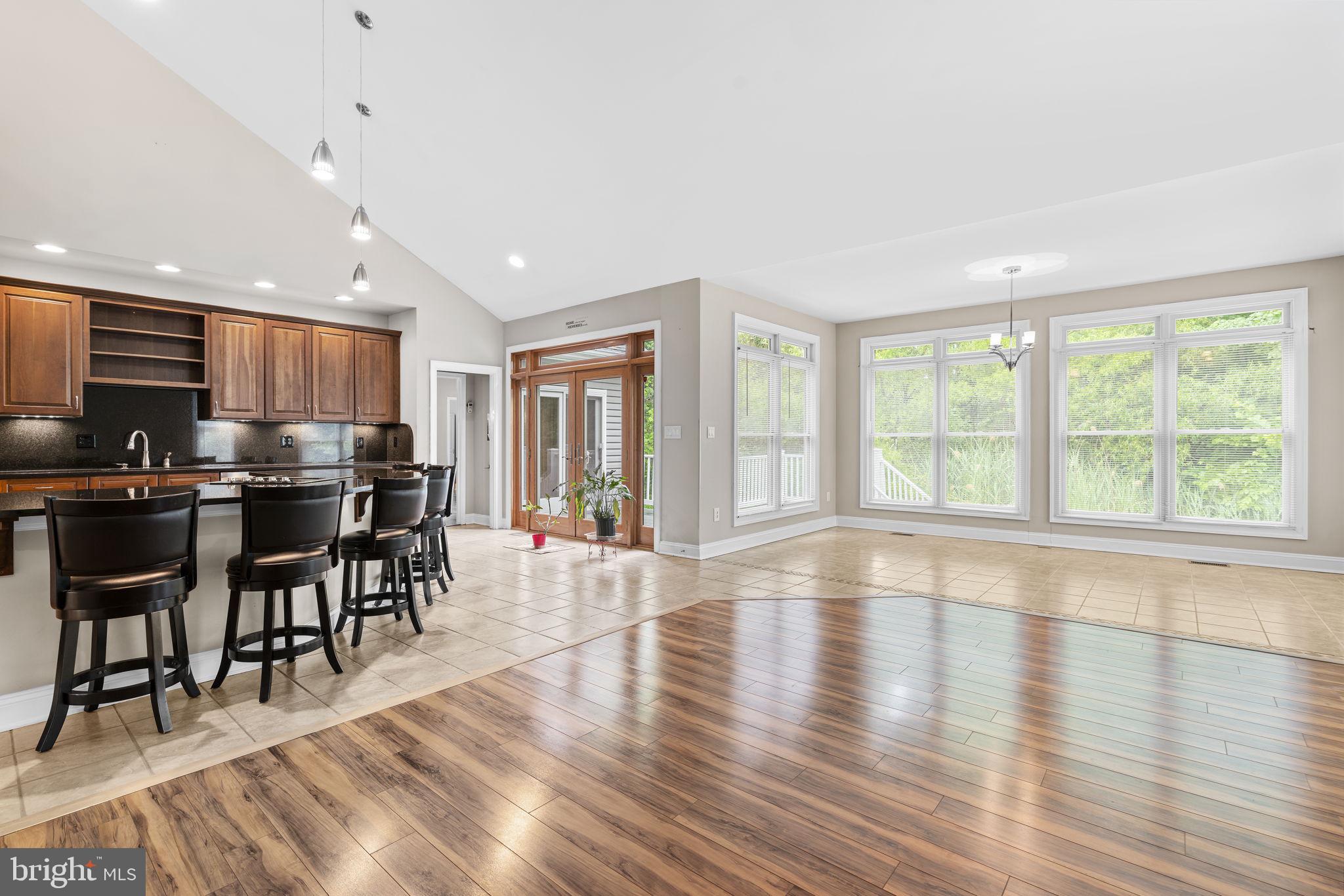8024 Solley Road Glen Burnie, MD 21060 - Photo 31 of 83 a view of a kitchen with dining room and wooden floor