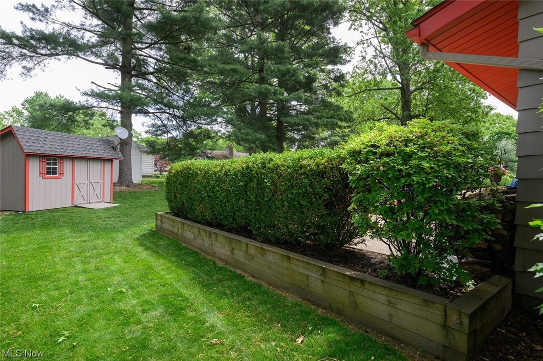 572 Overwood Road Akron, OH 44313 - Photo 28 of 35 View of rear yard featuring a storage unit